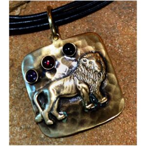 Antiqued Hammered Brass Lion Pendant on Rawhide by Elaine Coyne